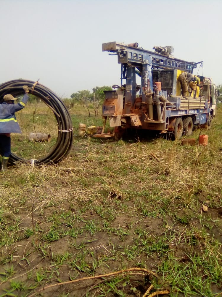 water well drilling rig getting set up to drill water in Northern Uganda