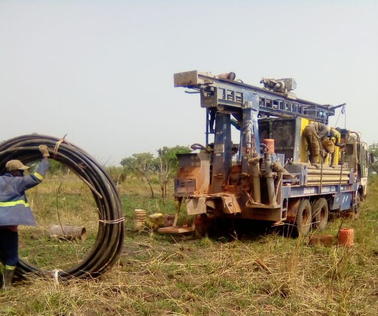 water well drilling rig getting set up to drill water in Northern Uganda