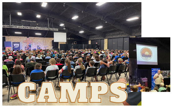 a large group of people are sitting in a room with the word camps written on it .