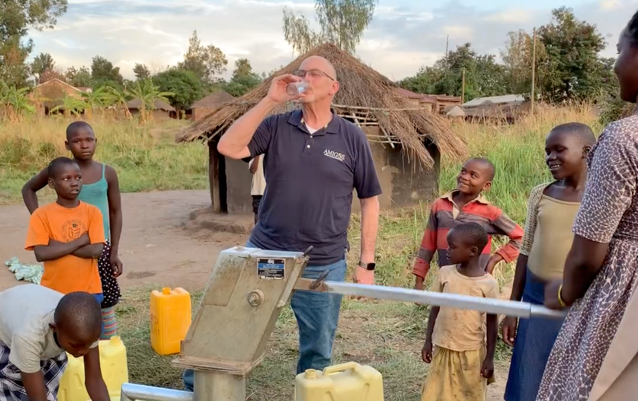 CEO Michael Ryer drinking  fresh, clean, disease free water from a newly drilled water well.