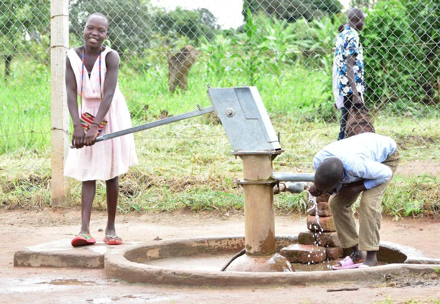 Children at the Amigos water well project in Ogul Village, Uganda