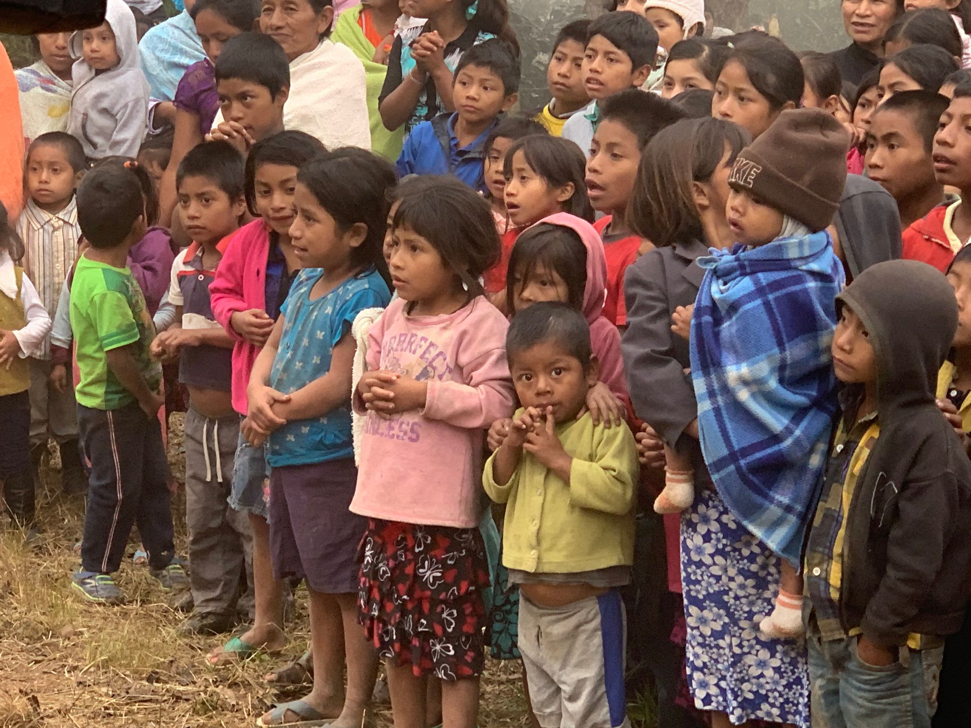 Hungry children in Guatemala await food provided by Amigos Internacionales.