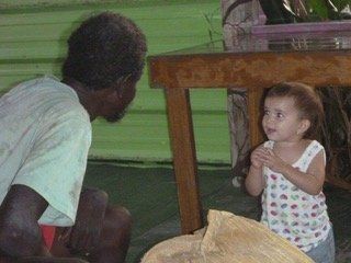 A man and a little girl are talking to each other