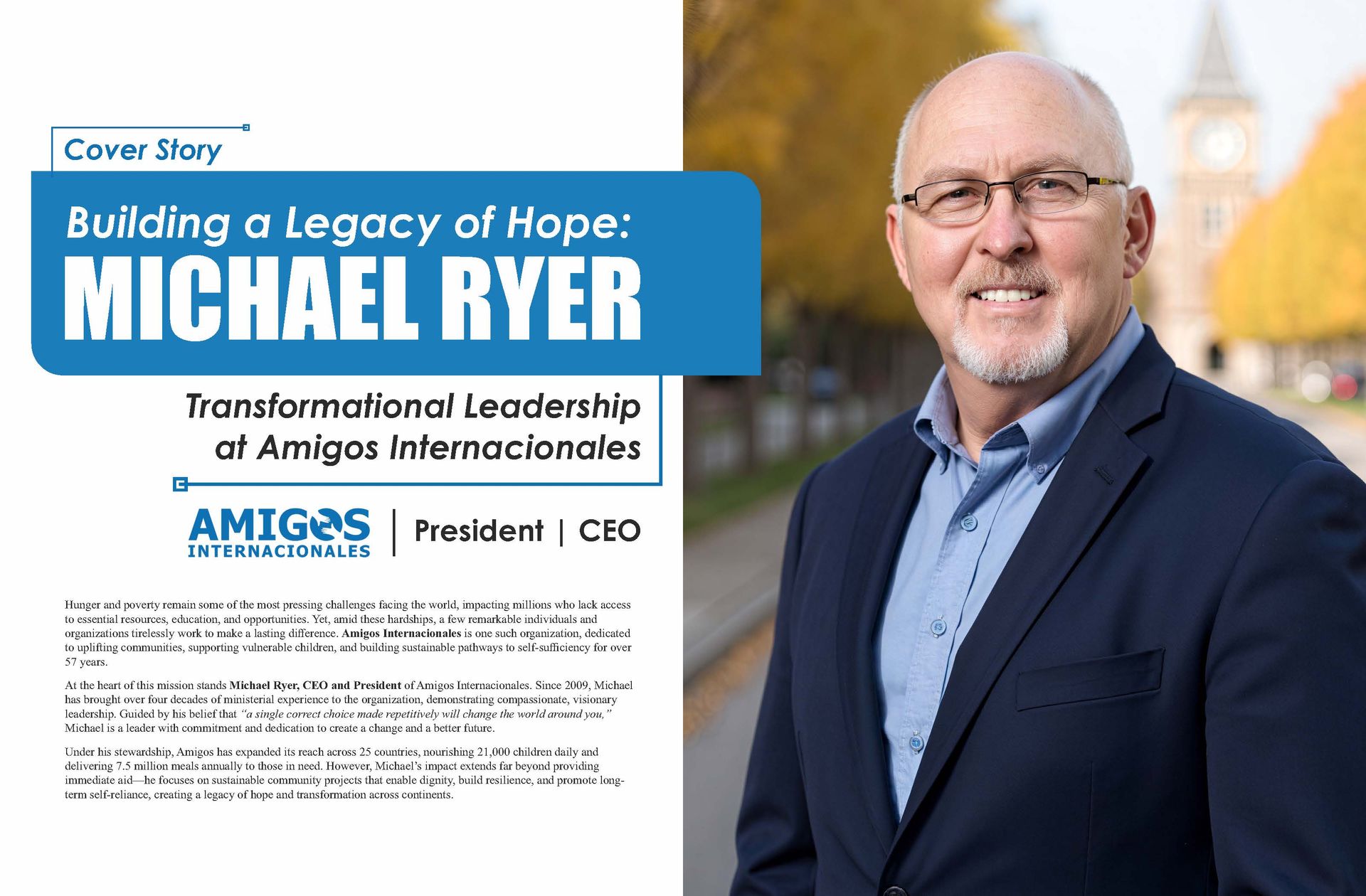 A man in a suit and glasses is standing in front of a sign that says building a legacy of hope.