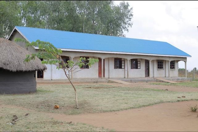 A large white building with a blue roof