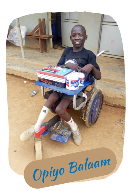 Smiling boy in wheelchair with school supplies. Outdoor setting.