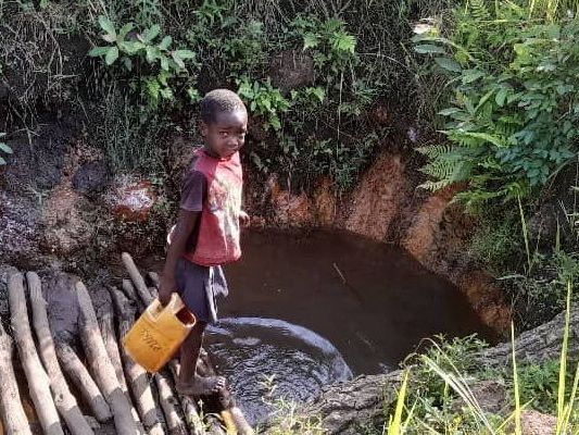 Sawye Village young boy collecting water
