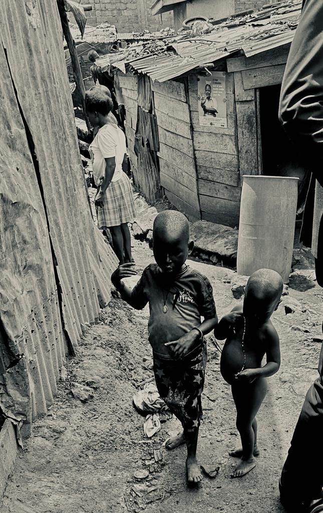 Starving Children in Africa walk the slums of Kampala 