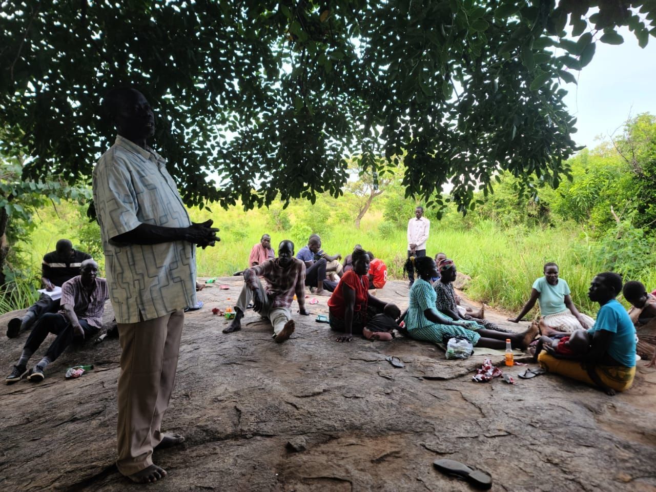 local villagers meet to discuss location of water well and the donation of land 