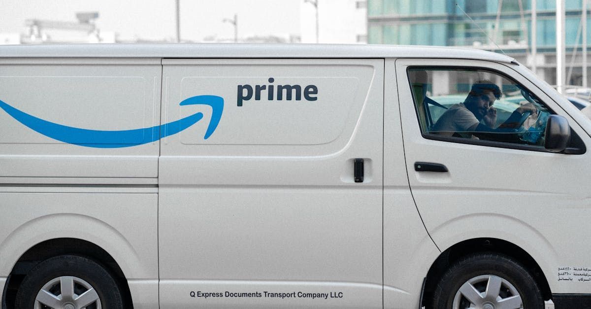 A white van with the word prime on the side is parked in a parking lot.