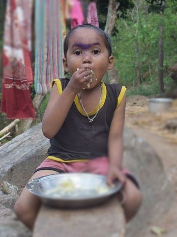 Sukuma child eating 