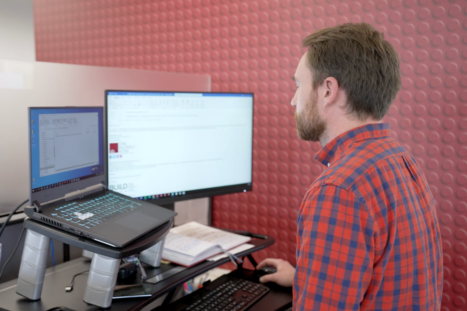 SBM team on a computer working in building design services