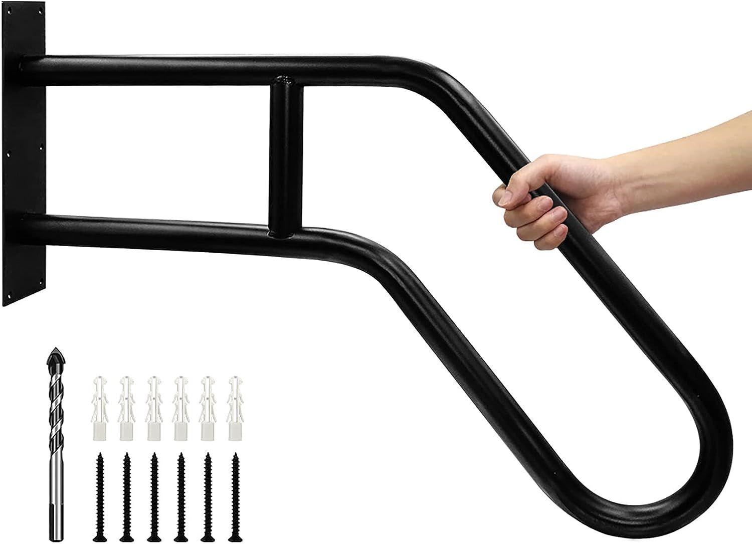 A person is holding a black railing with screws attached to it.