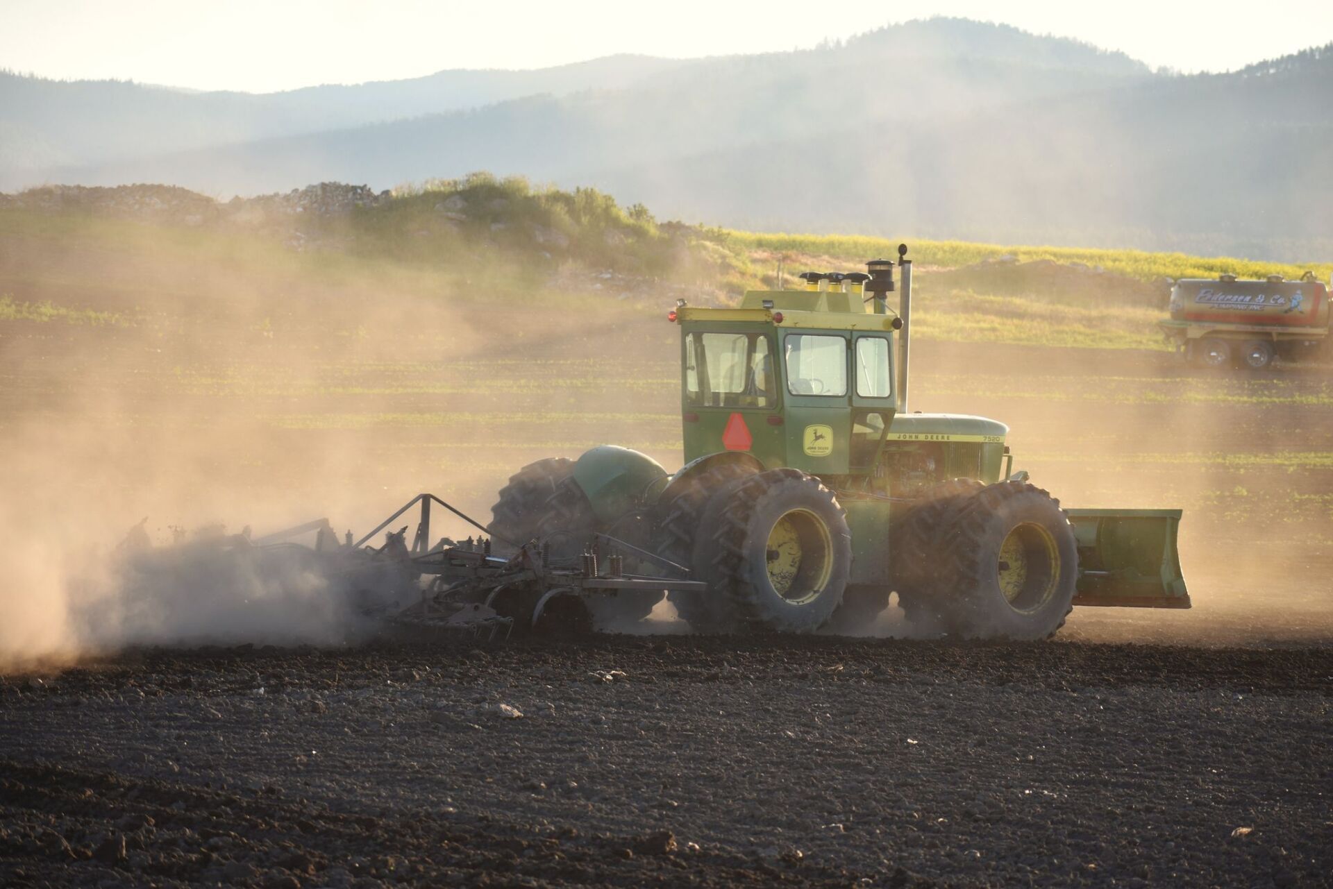 Tractor doing some work — Kalispell, MT — Pedersen & Co Pumping, Inc.