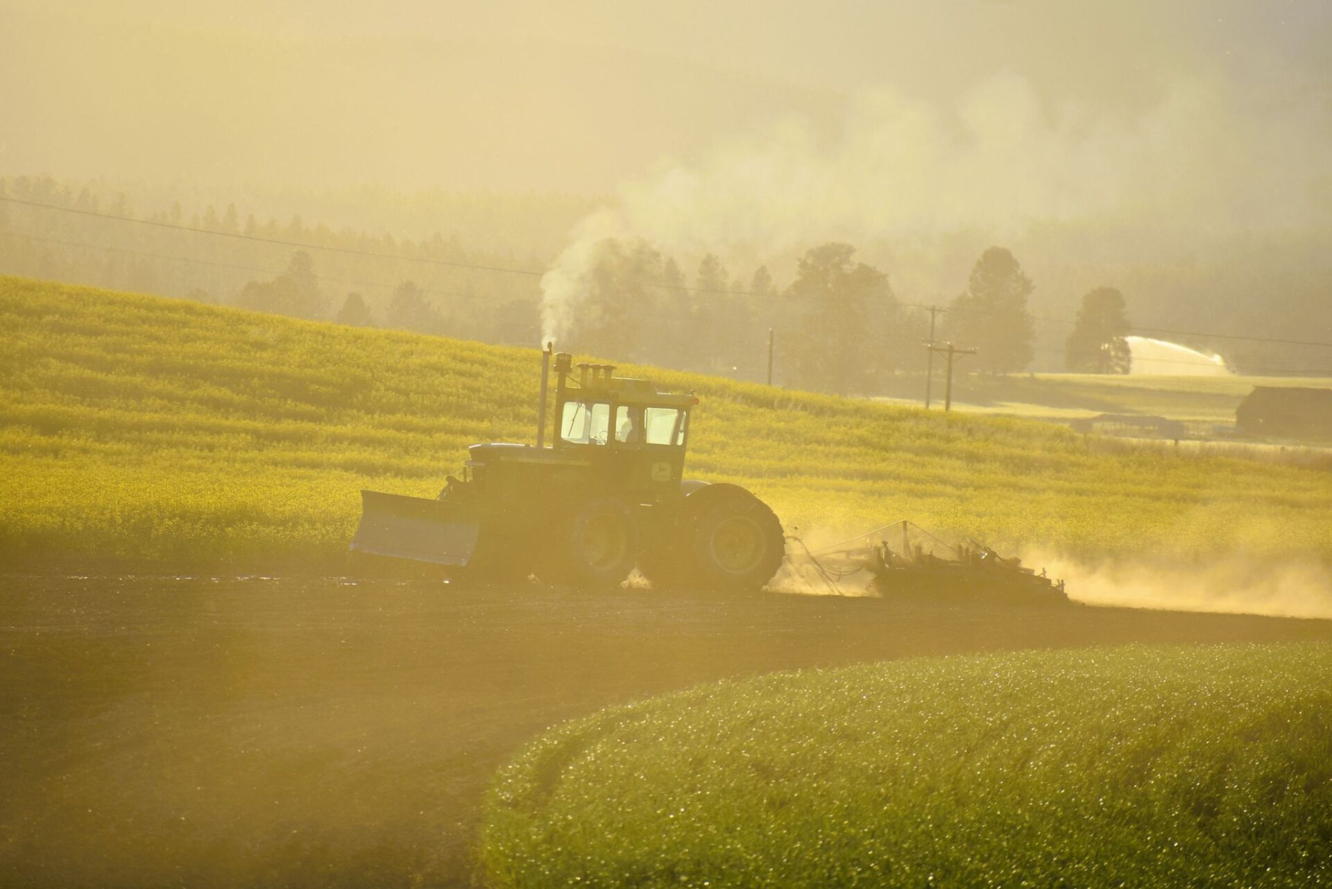 Tractor on a foggy environment — Kalispell, MT — Pedersen & Co Pumping, Inc.