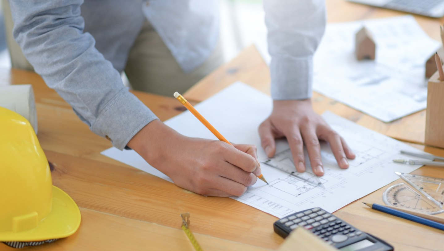 contractor writing on paper