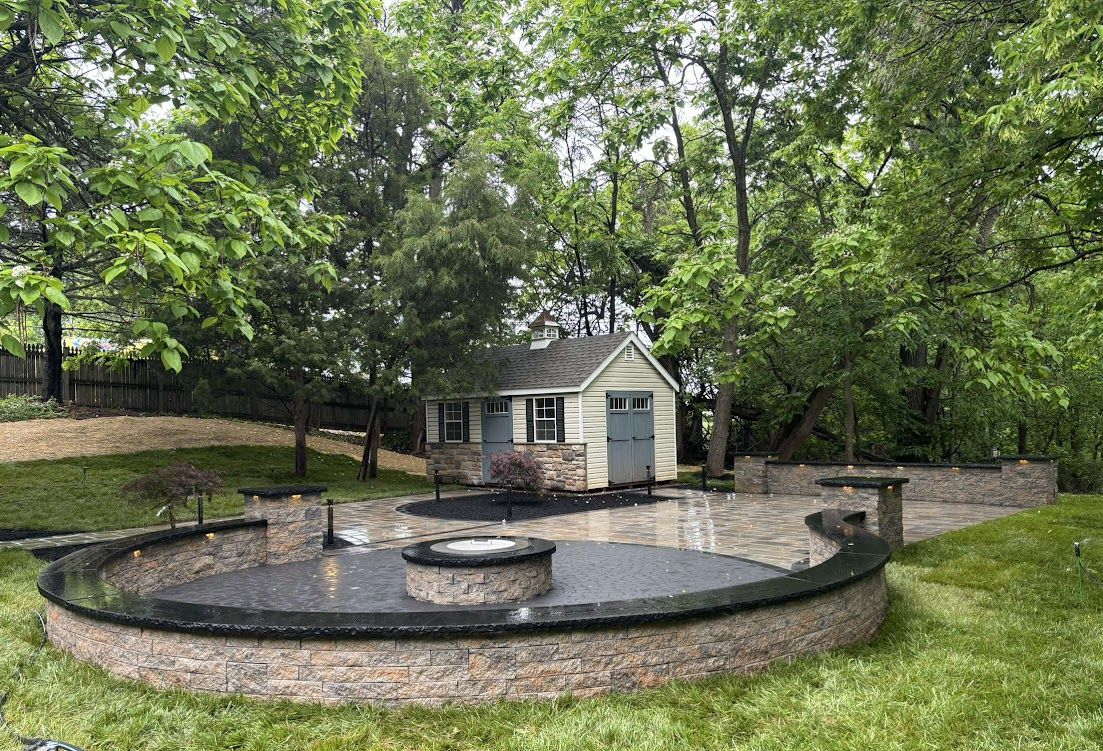 Paver patio with firepit and sitting walls. Paver patio with firepit and sitting walls.