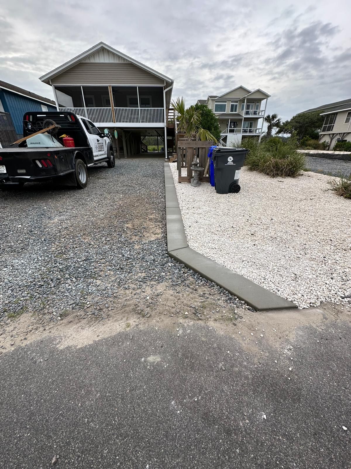 A truck is parked in front of a house.