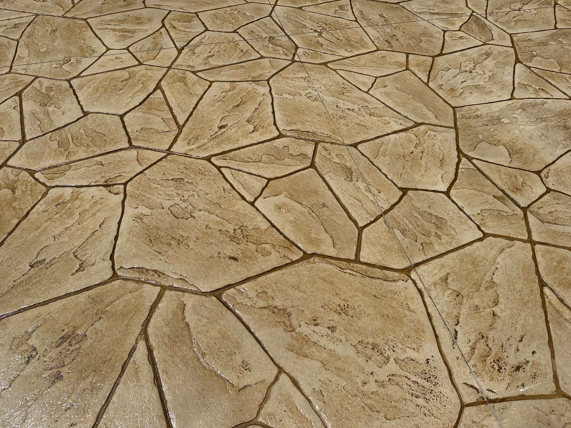 A close up of a concrete floor with a geometric pattern