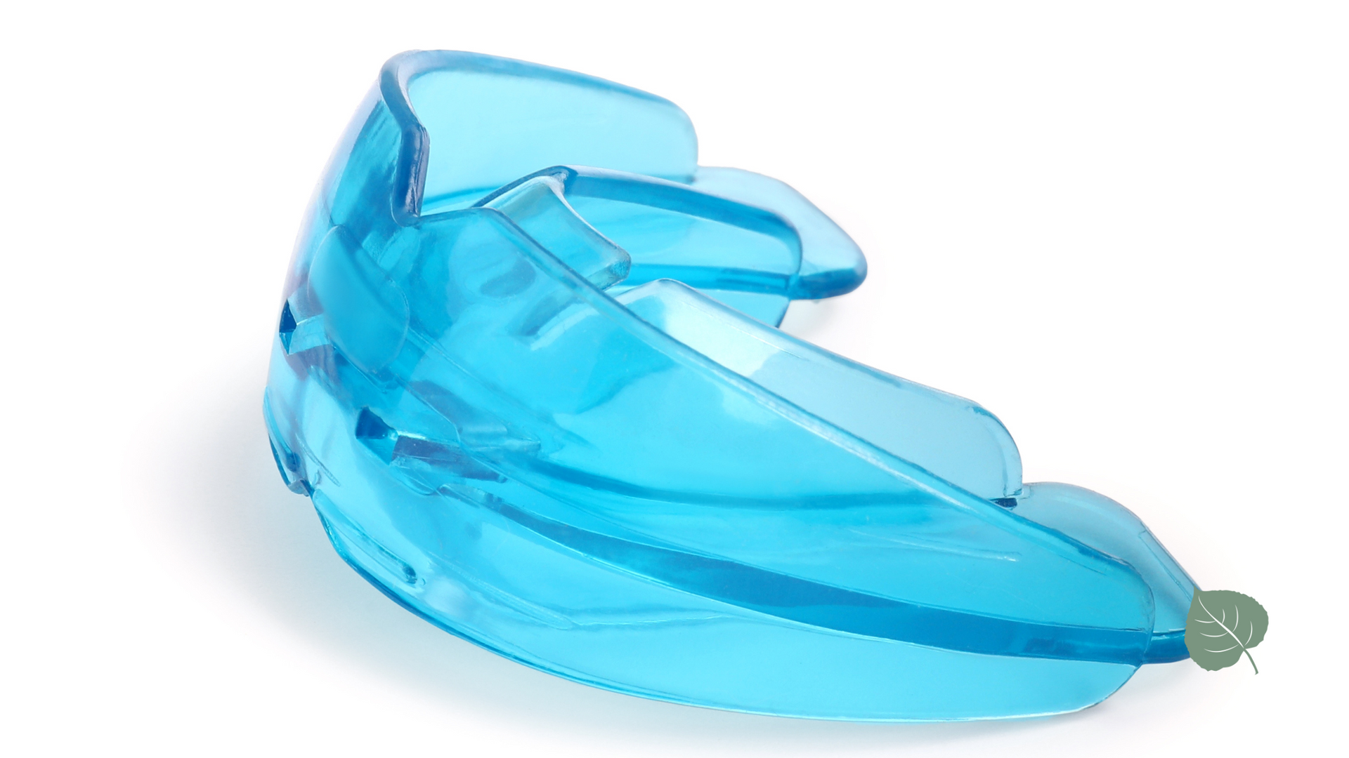 A blue mouth guard is sitting on a white surface.