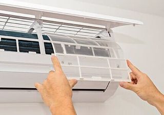 Air Conditioning Repair — Air Conditioner On A White Wall in Huntley, IL