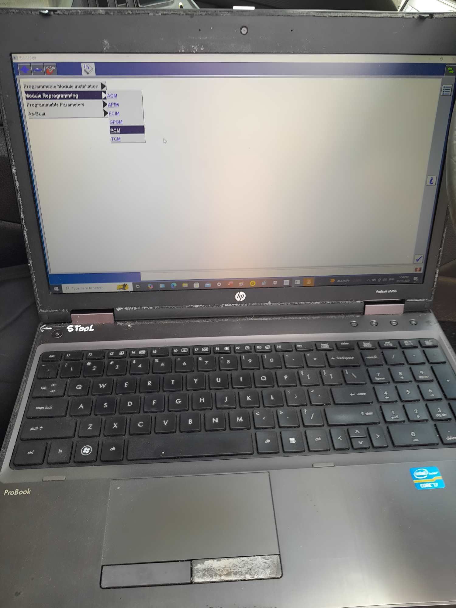 A Laptop Computer With a Blank Screen is Sitting on a Table — Fraser Mobile Auto Tech in Tolga, QLD