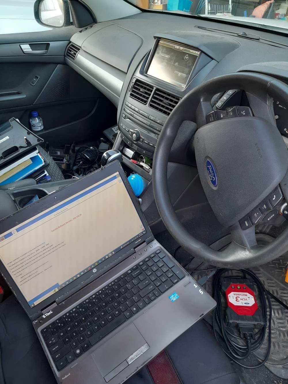 A Laptop is Sitting in the Driver 's Seat of a Car — Fraser Mobile Auto Tech in Tolga, QLD