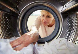 Woman doing laundry- Appliance Repair in Spokane, WA