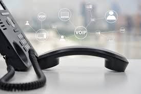 A telephone is sitting on top of a white table.