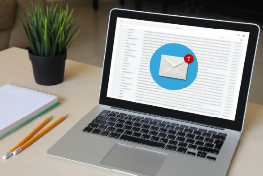 A laptop computer with an envelope on the screen