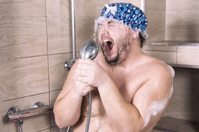 man singing in shower