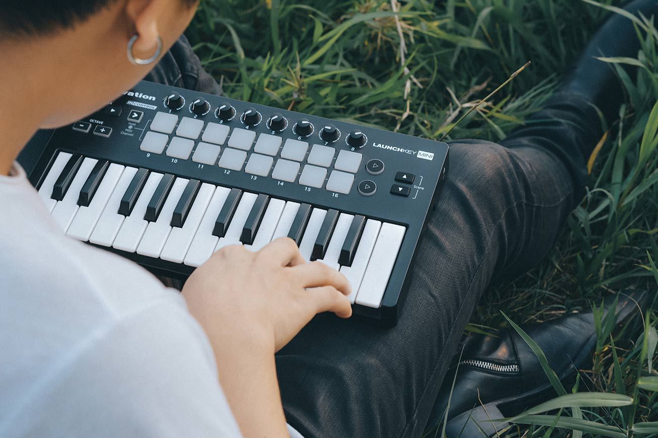 Music Producer Playing Mini Keyboard