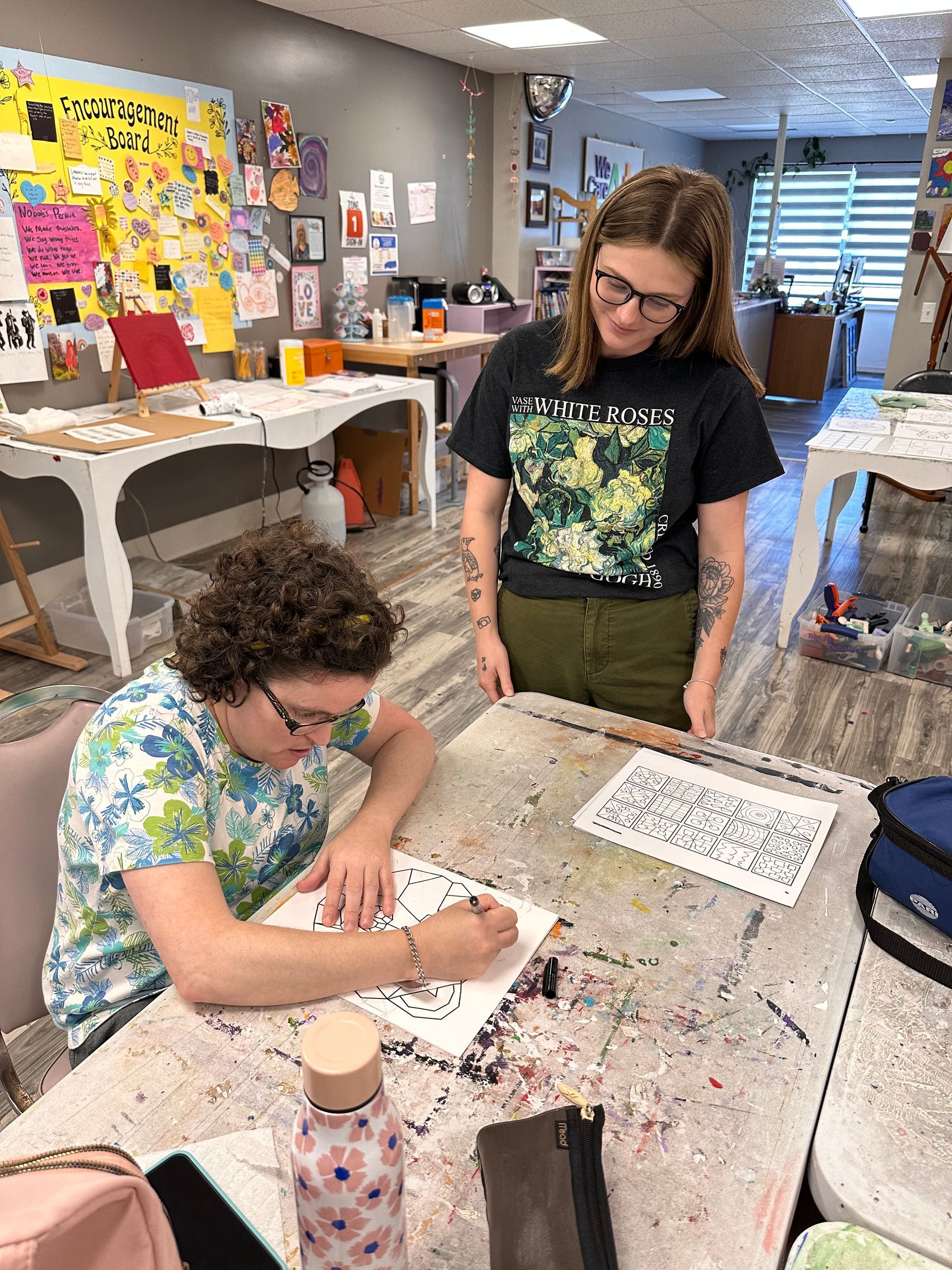 We Care Arts teacher Cassie and artist-client, Becky B.