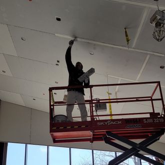 man working on drywall