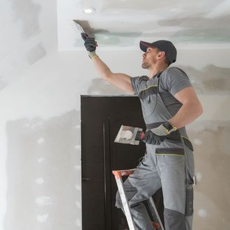 man working on drywall