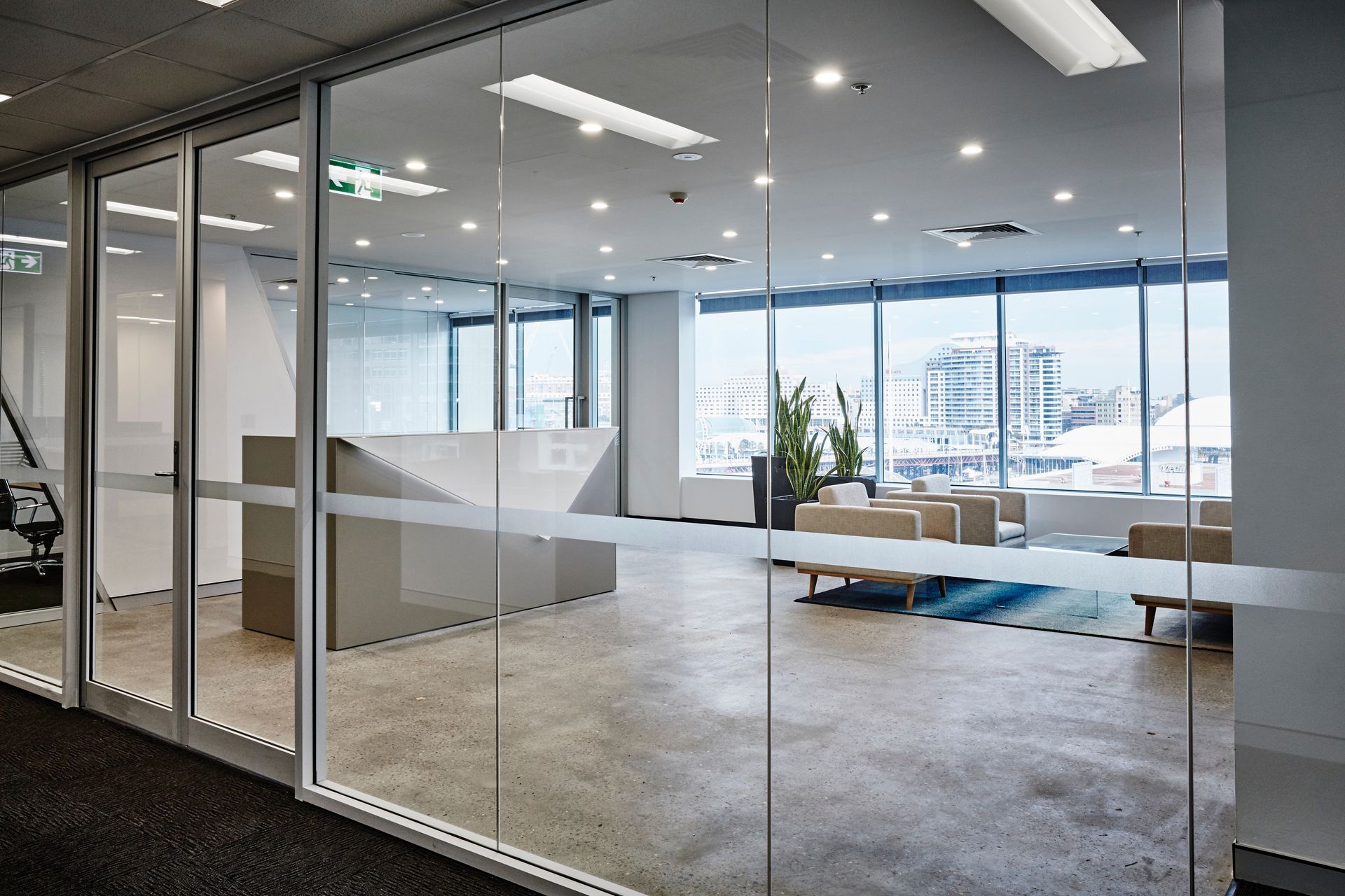 A large room with a lot of windows and a glass wall.