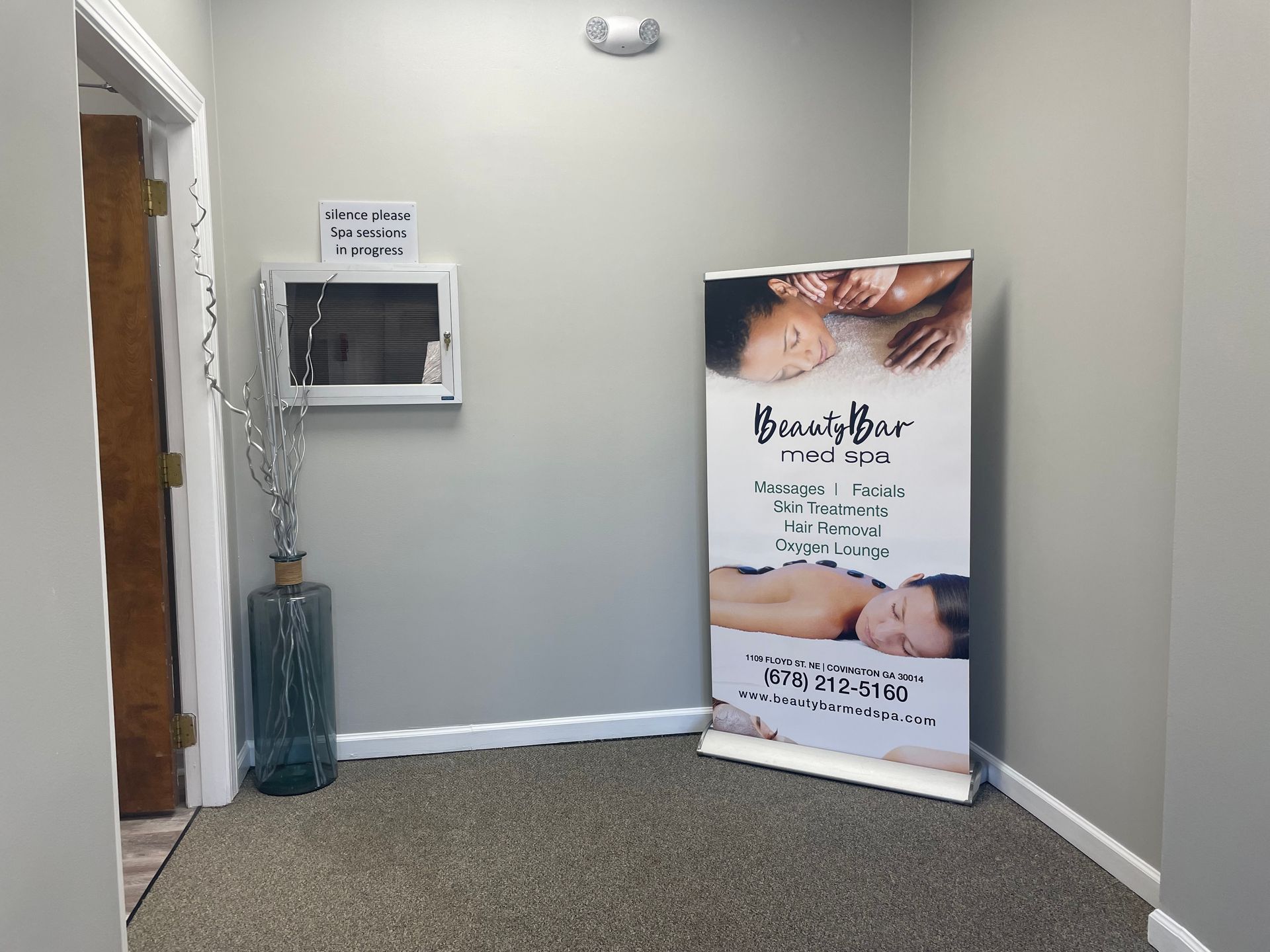 A room with a sign that says ' beauty bar ' on it