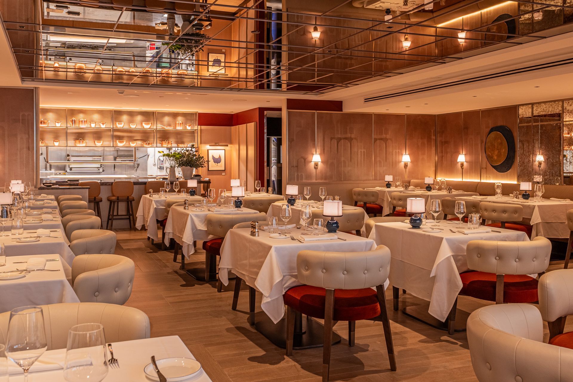 Multi-story building with ornate facade and balconies, contrasting with a plain white side.