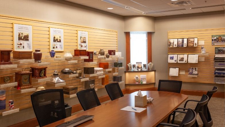 a conference room with a table and chairs in it .