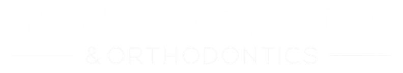 Faint white text on a white background, nearly unreadable.