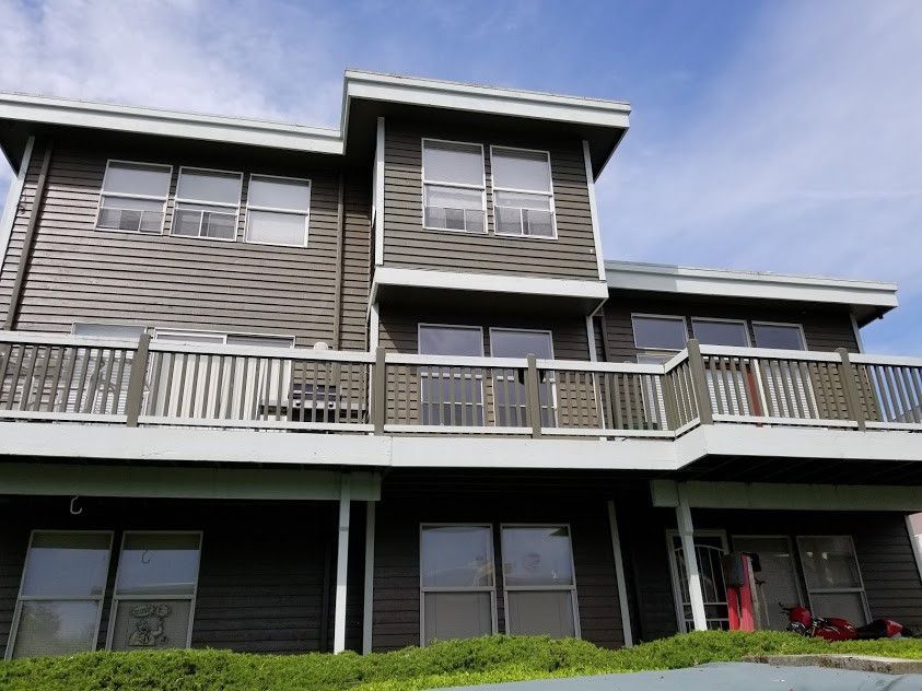A large house with a balcony and a lot of windows