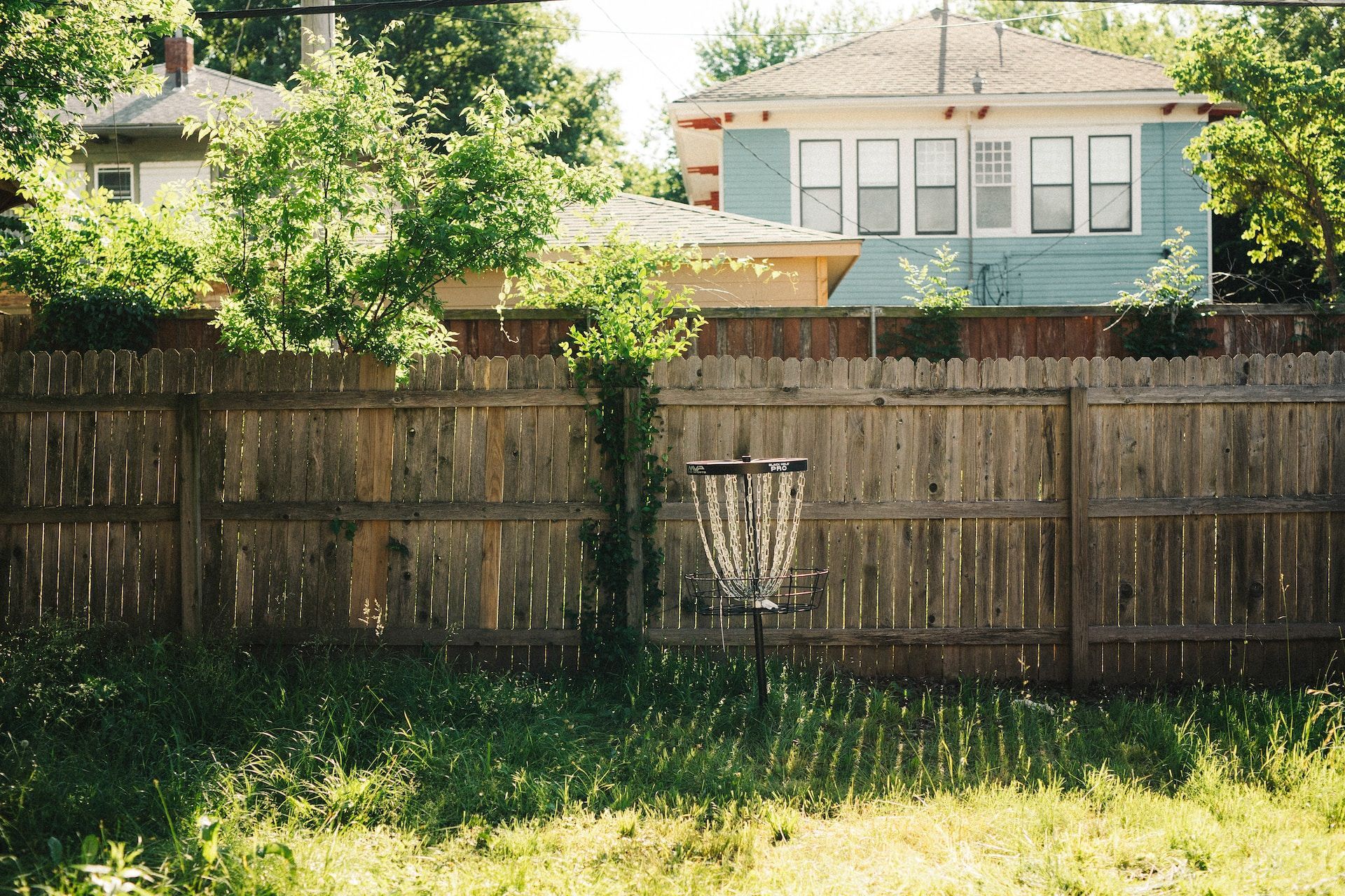 A wooden fence stretching across a backyard