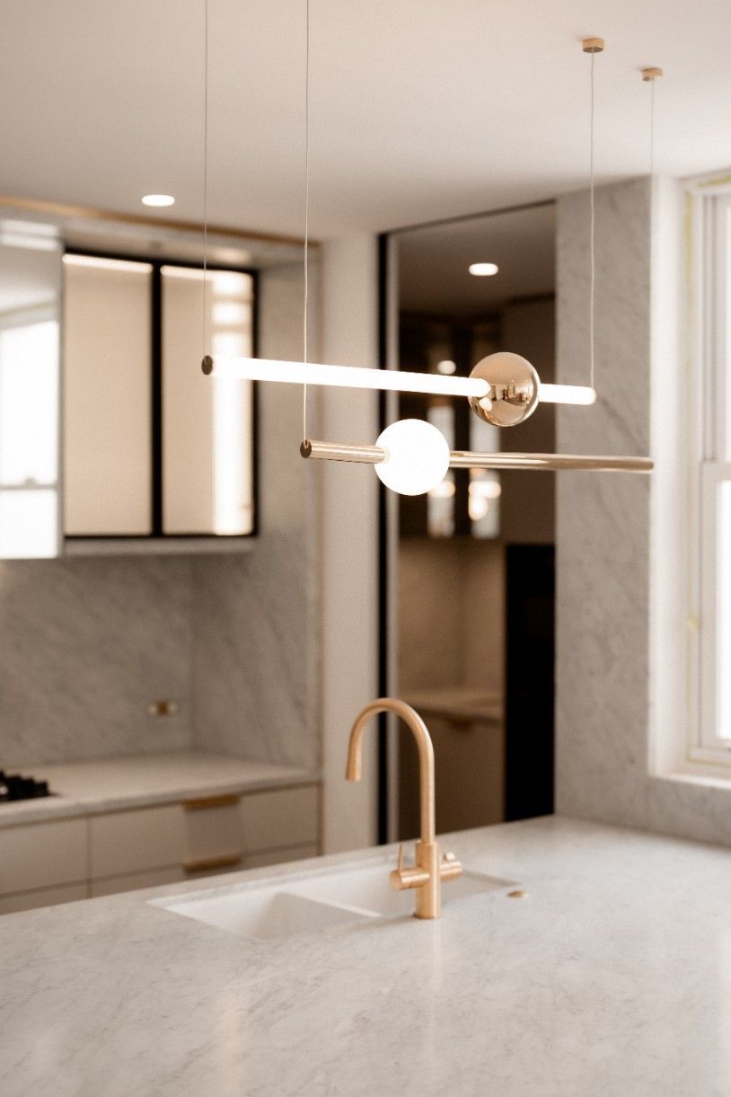 A Kitchen With a Sink and a Light Hanging From the Ceiling — John McEwan Electrical in Dapto, NSW