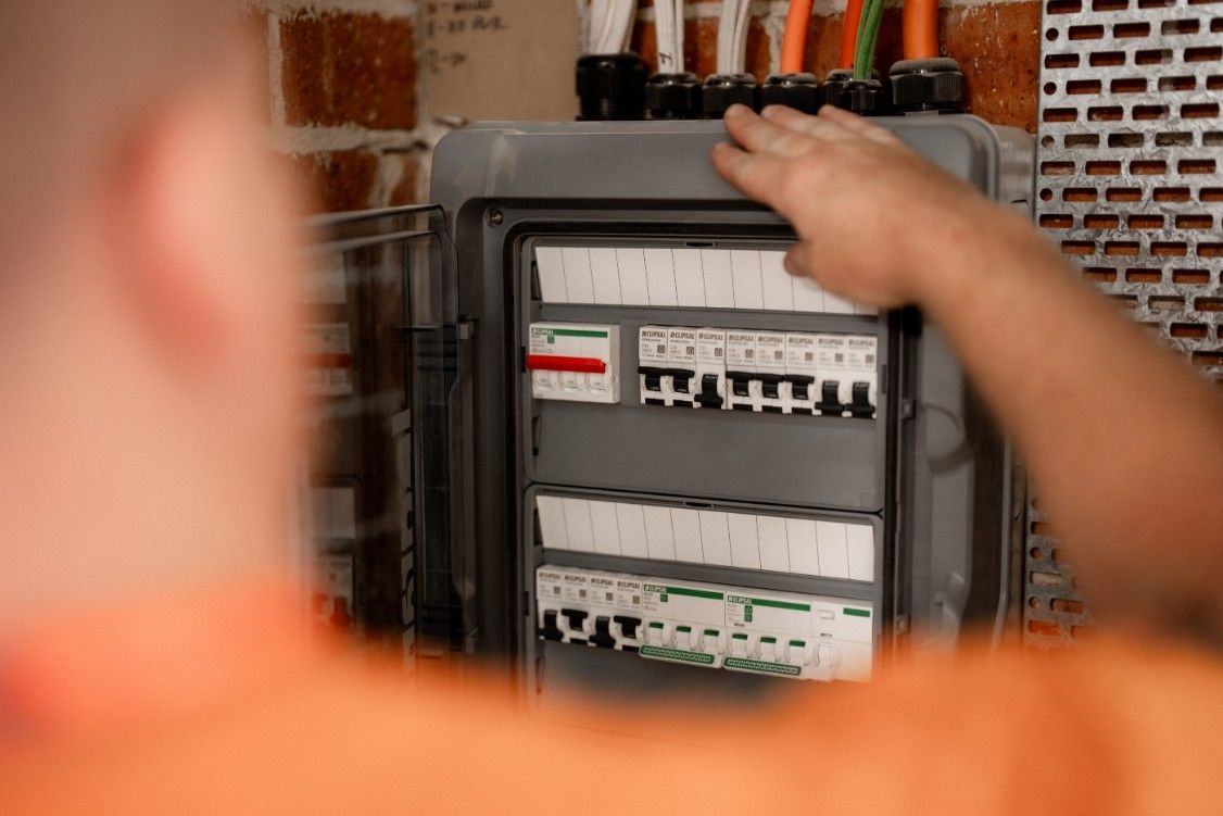 Electrician looking at a switchboard