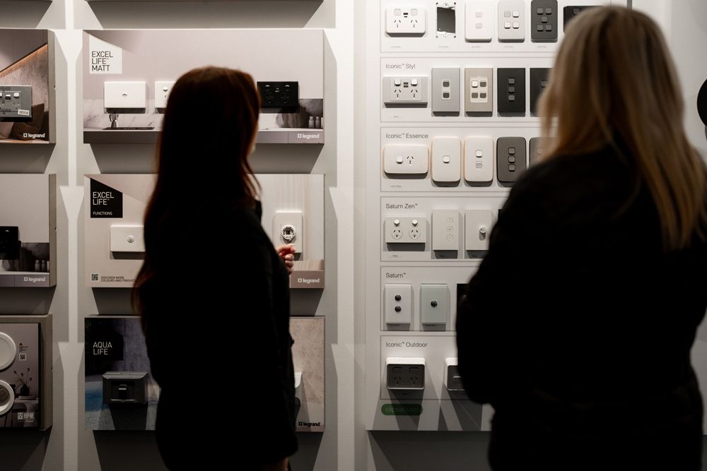 Two Women Checking Different Types of Power Points