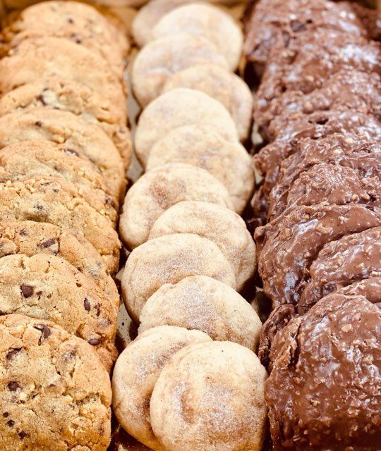 A variety of cookies are lined up in a row