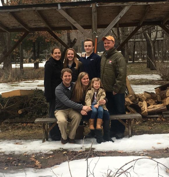 a group of people posing for a picture in the snow