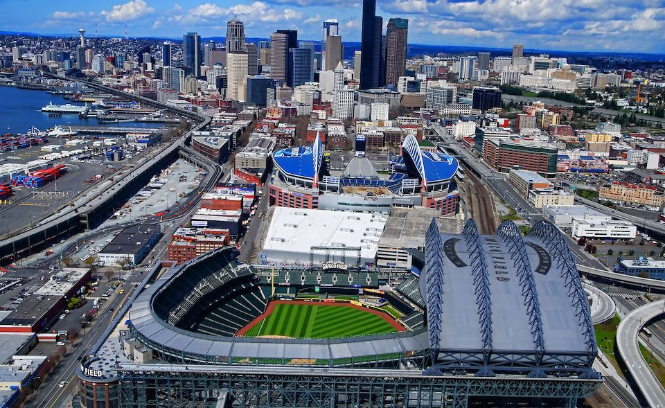 An aerial view of a baseball stadium in a city