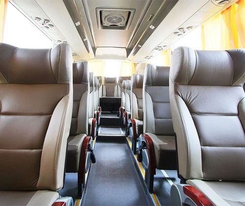 The inside of a bus with a lot of seats