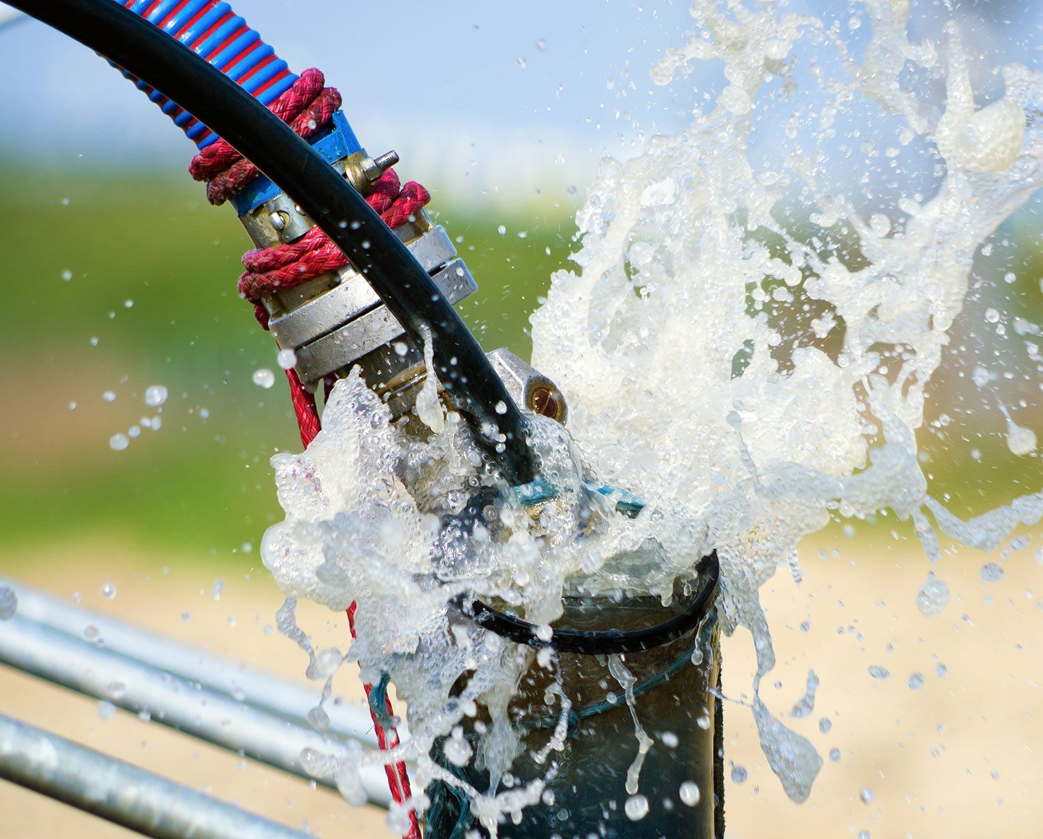 Water well pump spraying water